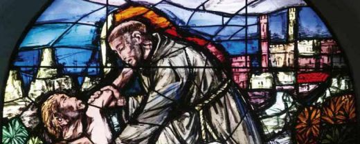 «San Francesco incontra il lebbroso», vetrata policroma su progetto di Fiorenzo Ioni di Siena (1968), Chiesa dei Padri Francescani a San Piero in Bagno (FC).
